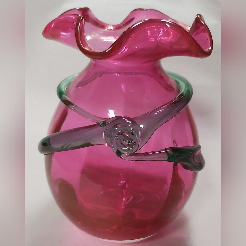 Vintage art glass cranberry vase with applied green ribbon